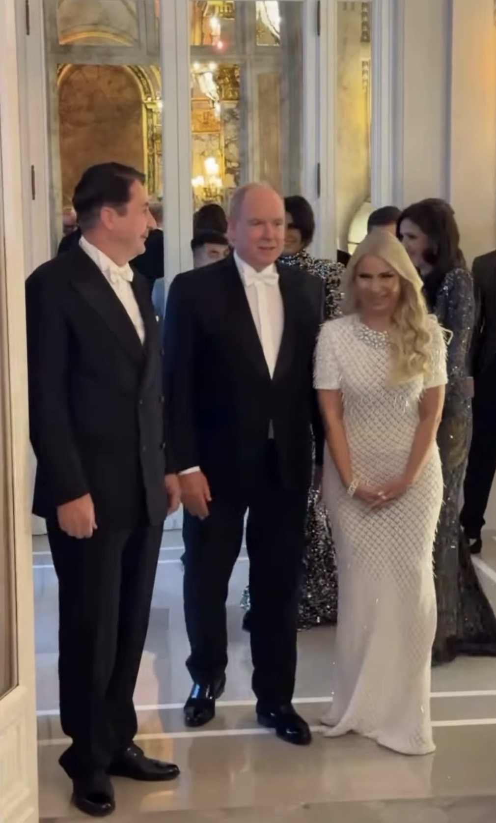 Gala guests arriving through the ornate entrance to the reception rooms